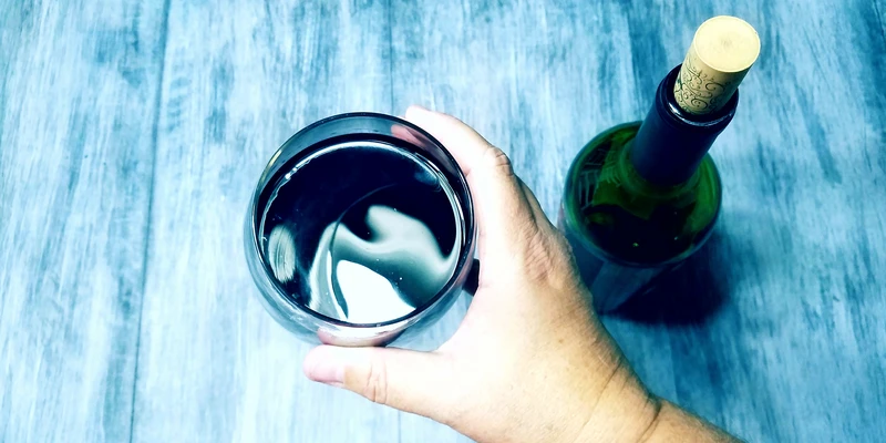 twilight alcohol detox person holding wine glass bottle