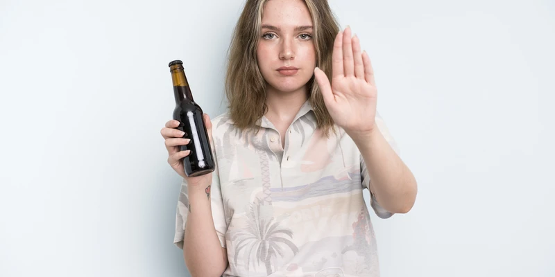 twilight alcohol detox woman holding beer bottle making stop