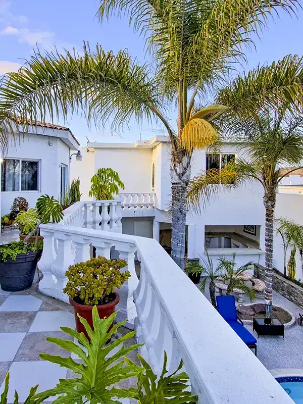 twilight balcony pool palm trees