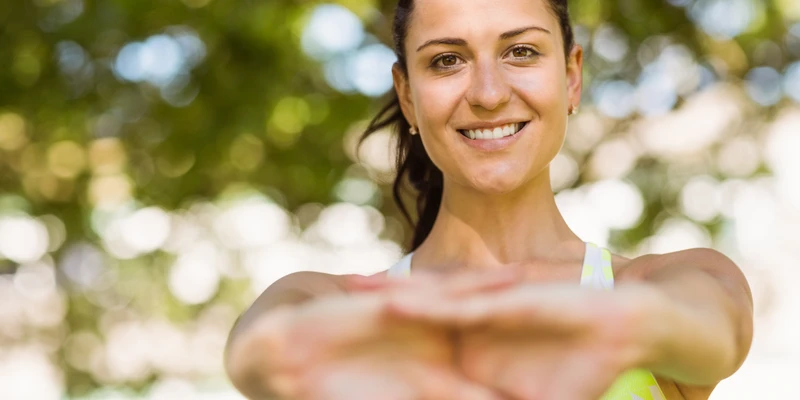 twilight environment woman doing yoga park enviroment