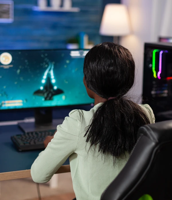 twilight gaming addiction girl sitting desk computer