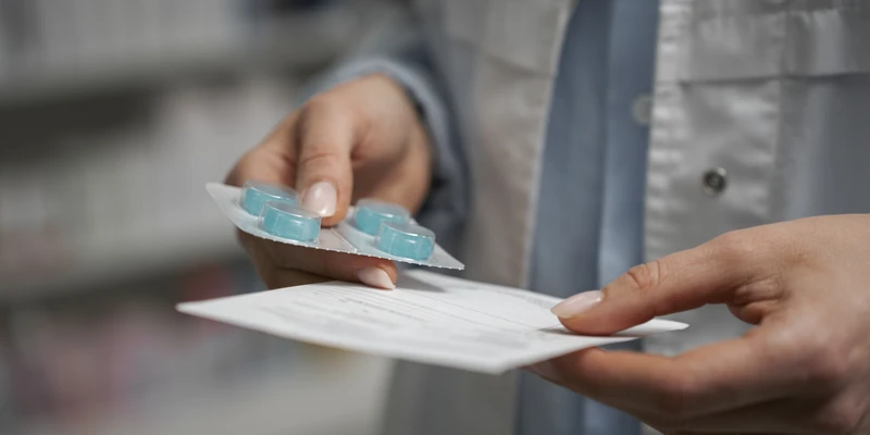 twilight prescription drug person holding pill hand