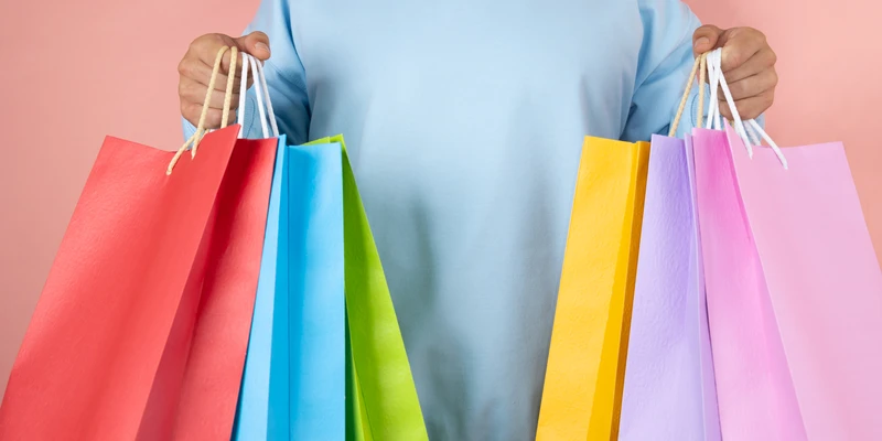 twilight shopping addiction woman holding bags