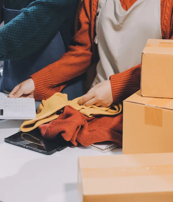 twilight shopping addiction woman packing boxes laptop