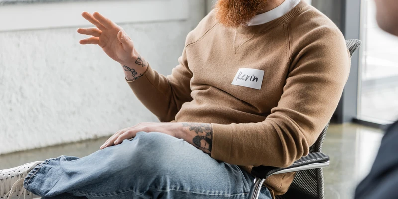 twilight therapy man red beard sitting chair