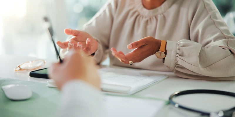 twilight therapy woman sitting table laptop pen