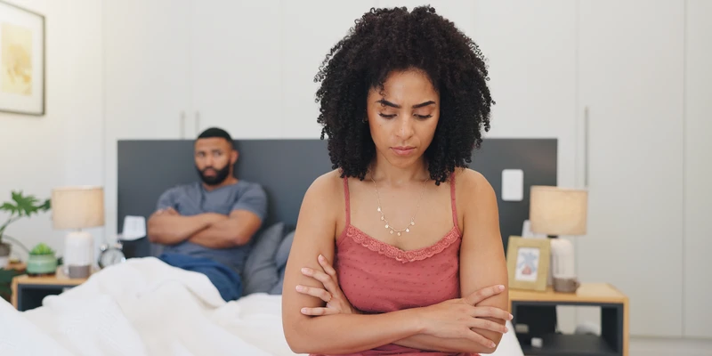 twilight woman sitting bed arms crossed sex porn addiction